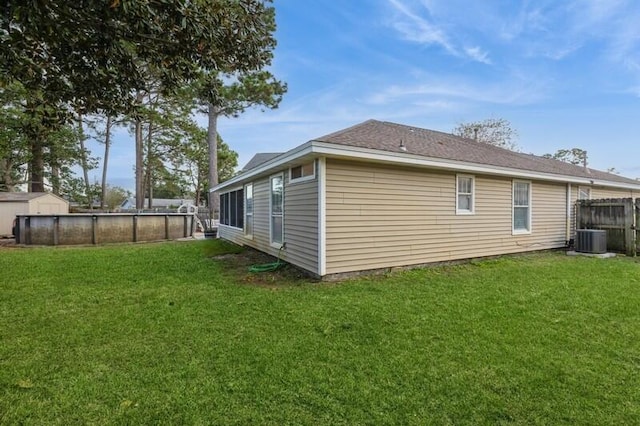 view of property exterior featuring a yard and cooling unit