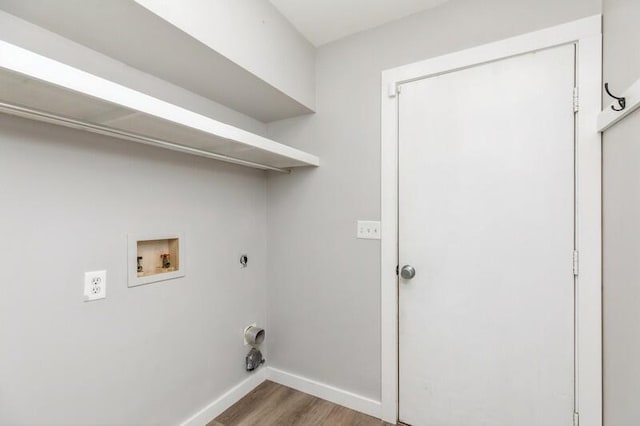 clothes washing area with washer hookup, electric dryer hookup, and wood-type flooring