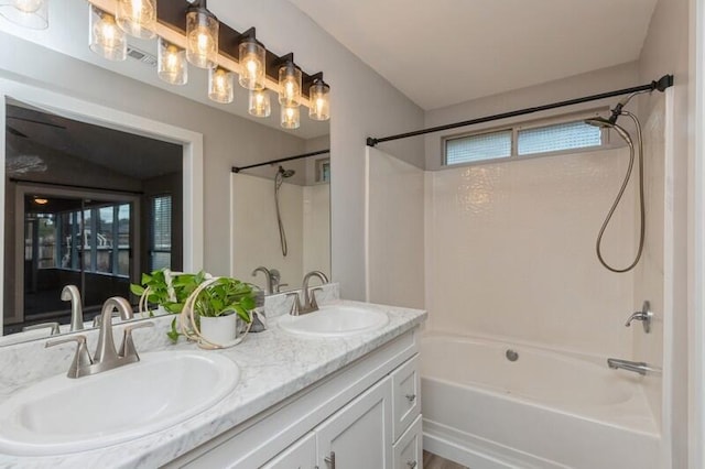 bathroom with vanity and shower / bath combination