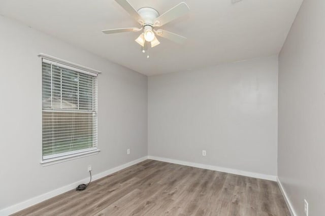 spare room featuring ceiling fan and light wood-type flooring