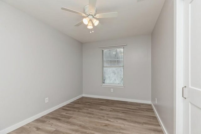 unfurnished room featuring ceiling fan and light wood-type flooring