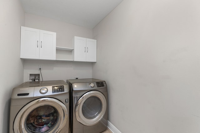 laundry area featuring cabinets and independent washer and dryer