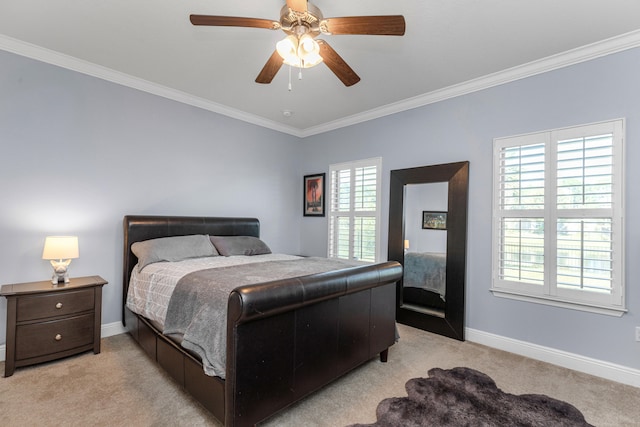 bedroom featuring multiple windows, light colored carpet, ceiling fan, and crown molding