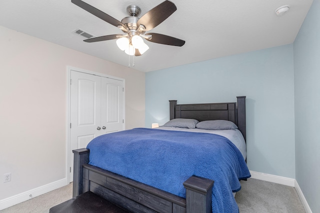 bedroom with light carpet, a closet, and ceiling fan