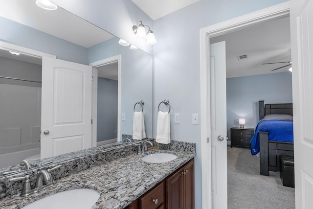 bathroom with ceiling fan and vanity