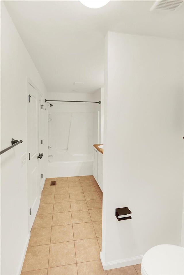 full bathroom featuring vanity, tile patterned floors, shower / bathtub combination, and toilet