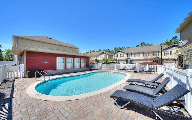 view of swimming pool with a patio area