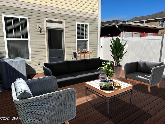 deck featuring cooling unit and an outdoor hangout area