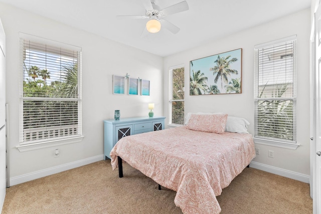 bedroom featuring ceiling fan and light carpet