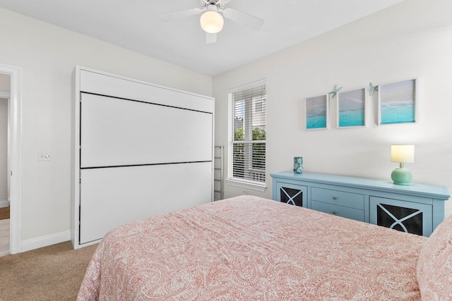 bedroom with ceiling fan and light colored carpet