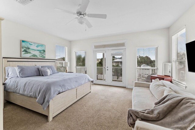 bedroom featuring multiple windows, ceiling fan, french doors, and access to exterior