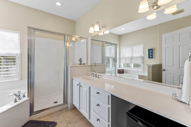 bathroom featuring vanity, tile patterned floors, and separate shower and tub