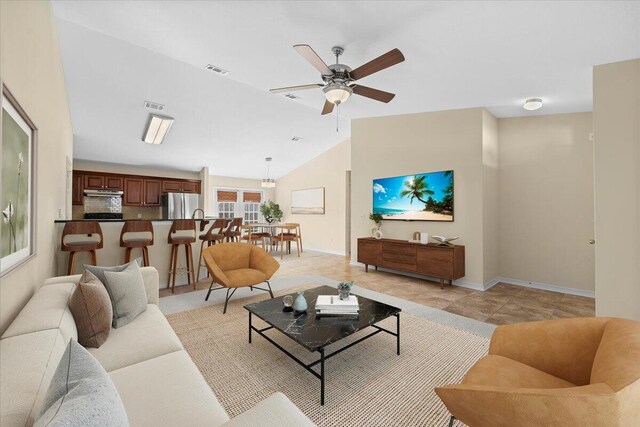 living room featuring vaulted ceiling and ceiling fan