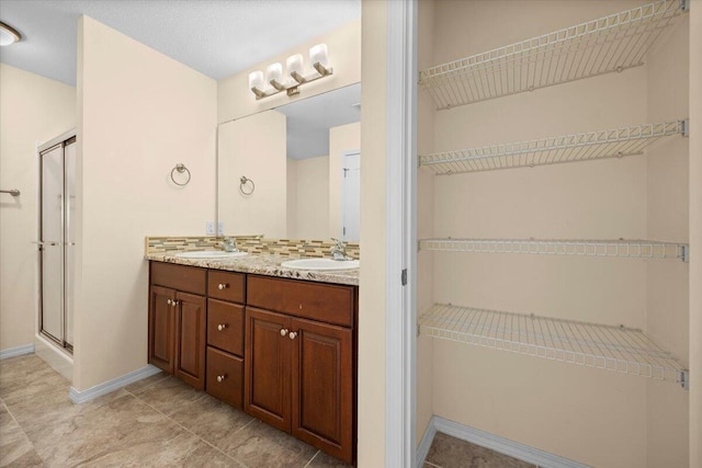 bathroom featuring vanity and walk in shower