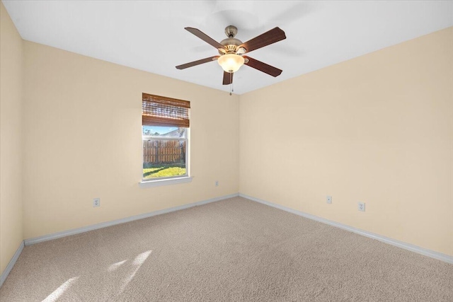 unfurnished room with carpet flooring and ceiling fan