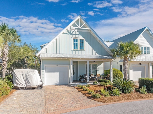 view of front facade with a garage and covered porch