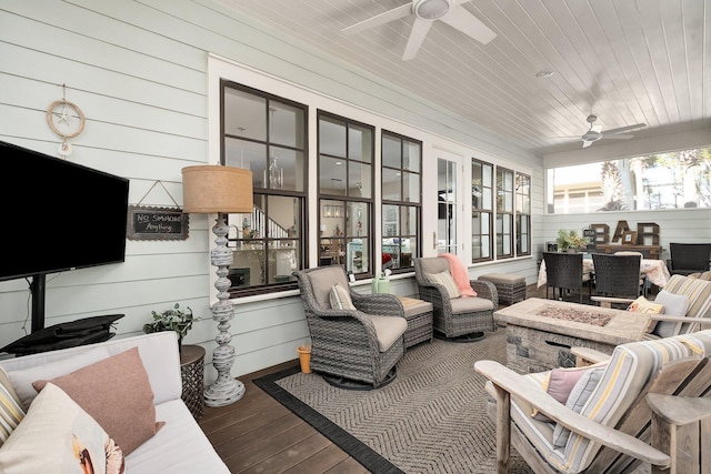 sunroom / solarium with ceiling fan and wooden ceiling