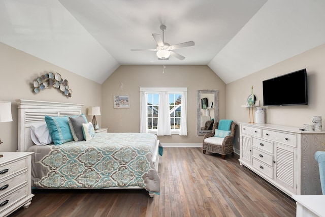 bedroom with ceiling fan, dark hardwood / wood-style flooring, and vaulted ceiling