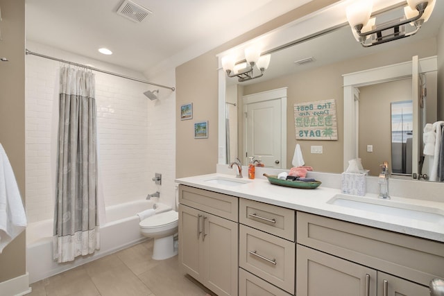 full bathroom featuring vanity, an inviting chandelier, tile patterned floors, toilet, and shower / tub combo with curtain