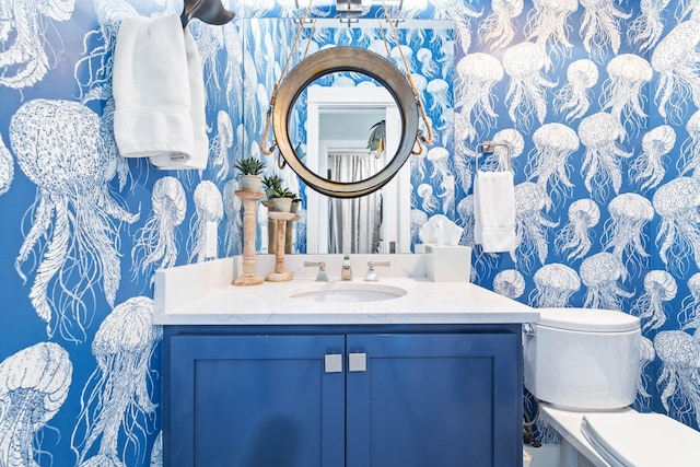 bathroom with vanity and toilet