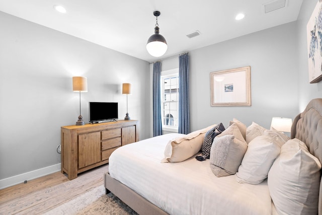 bedroom with light wood-type flooring