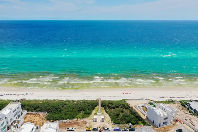 aerial view featuring a water view and a beach view