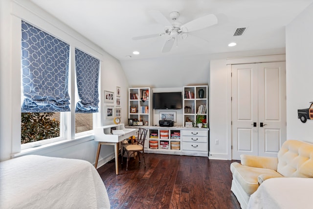 bedroom featuring dark hardwood / wood-style flooring, a closet, ceiling fan, and lofted ceiling