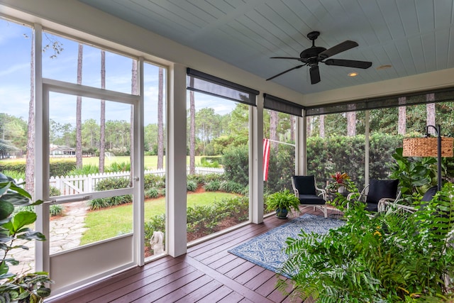 unfurnished sunroom with ceiling fan and a healthy amount of sunlight