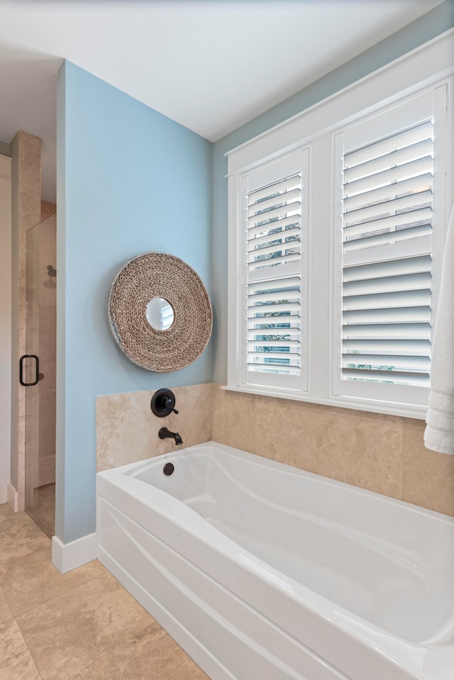 bathroom with tile patterned floors and separate shower and tub