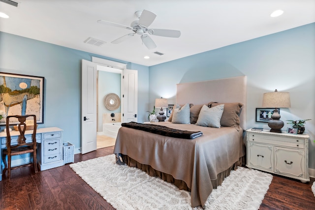 bedroom with dark hardwood / wood-style floors, ceiling fan, and ensuite bath