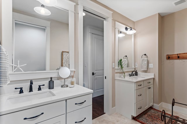 bathroom featuring vanity and hardwood / wood-style flooring