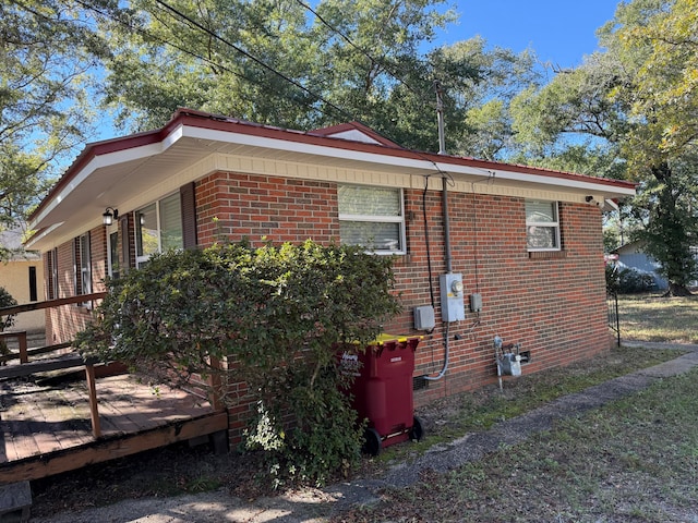 view of home's exterior featuring a wooden deck