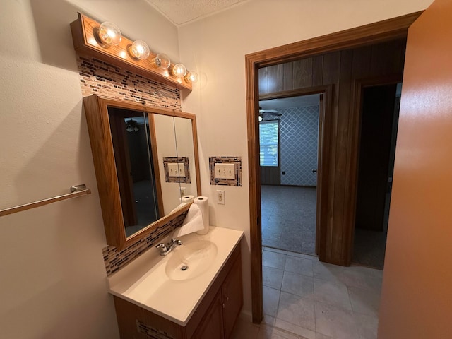 bathroom with tile patterned floors and vanity