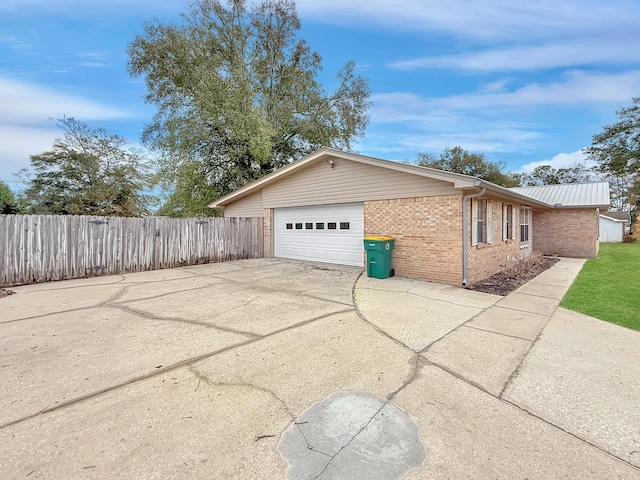 view of property exterior with a garage