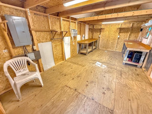 interior space featuring a wall mounted air conditioner and electric panel