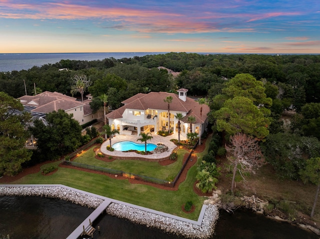 aerial view at dusk with a water view