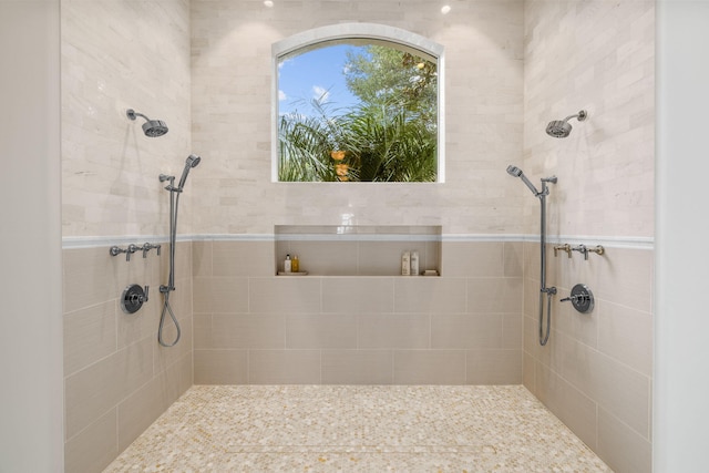 bathroom with a tile shower