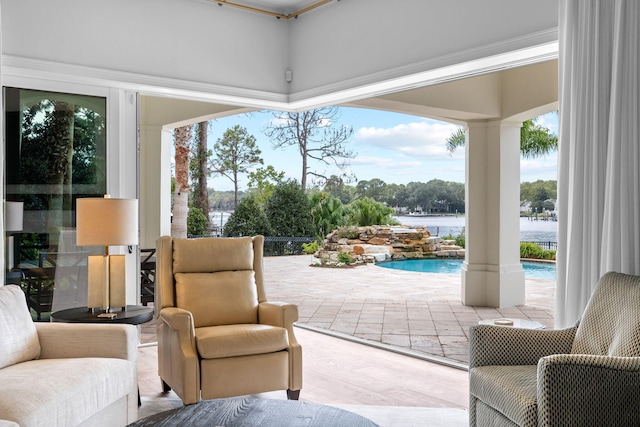 exterior space featuring plenty of natural light, a water view, and light wood-type flooring