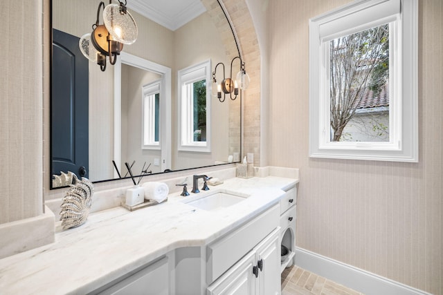 bathroom with vanity and crown molding