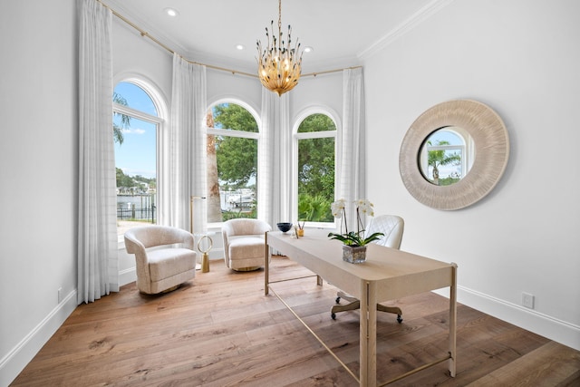 office area featuring wood-type flooring, an inviting chandelier, and ornamental molding