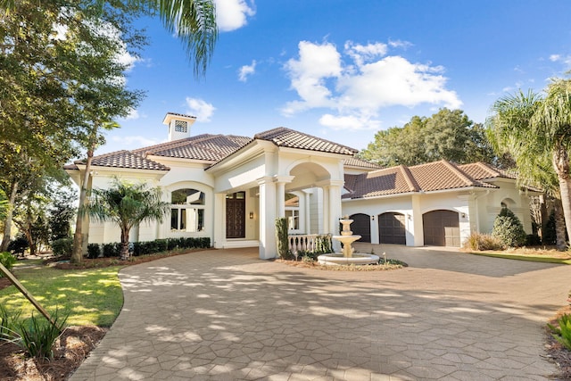 mediterranean / spanish house featuring a garage