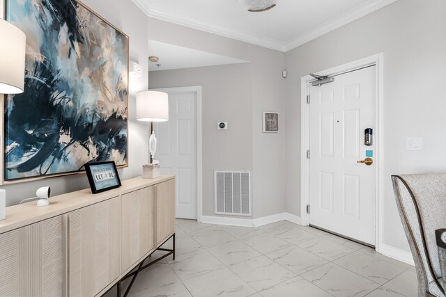 entryway featuring ornamental molding