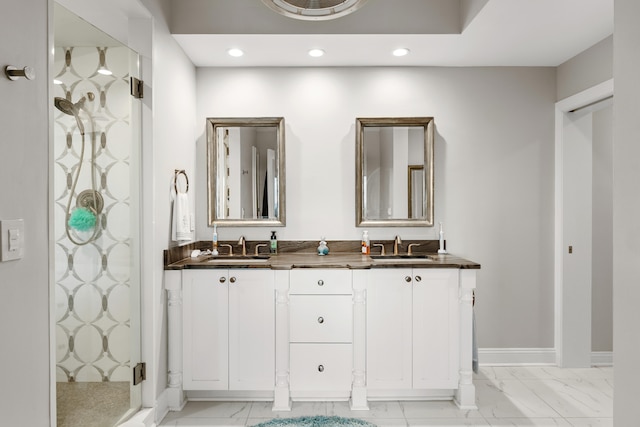 bathroom with vanity and a shower with shower door