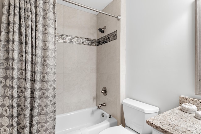 full bathroom with shower / tub combo, vanity, and toilet