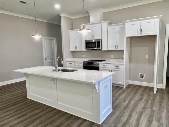 8405 Sevilla St, Navarre, FL 32566 - kitchen with appliances with stainless steel finishes, a sink, white cabinets, dark wood-type flooring, and crown molding