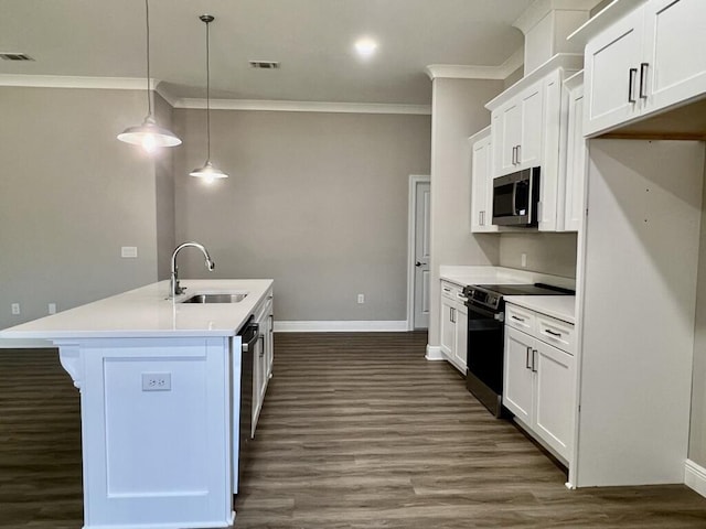 8405 Sevilla St, Navarre, FL 32566 - kitchen featuring appliances with stainless steel finishes, a sink, ornamental molding, baseboards, and dark wood-style floors