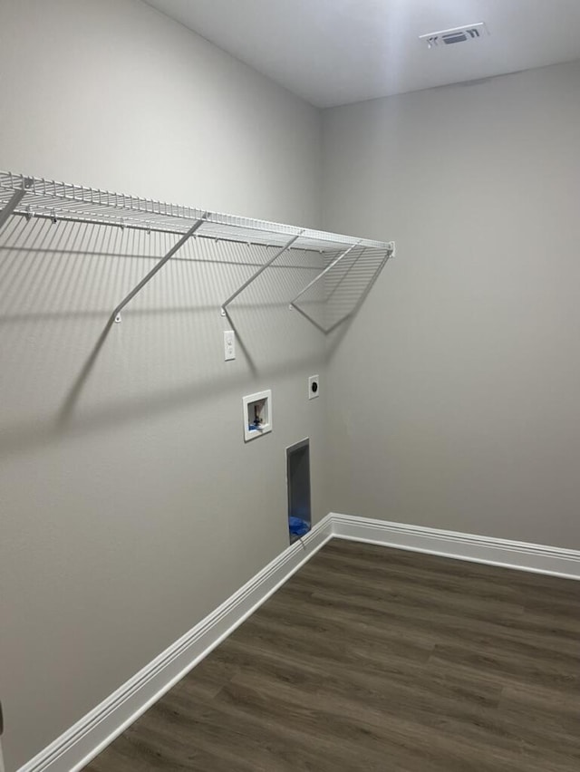8405 Sevilla St, Navarre, FL 32566 - laundry area featuring dark wood-style floors, baseboards, washer hookup, and electric dryer hookup