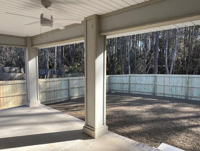 8405 Sevilla St, Navarre, FL 32566 - fenced backyard featuring a ceiling fan and a patio area