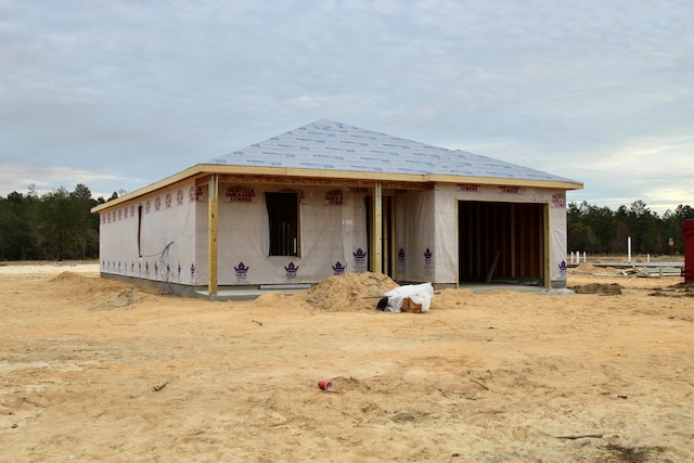 unfinished property with an outbuilding