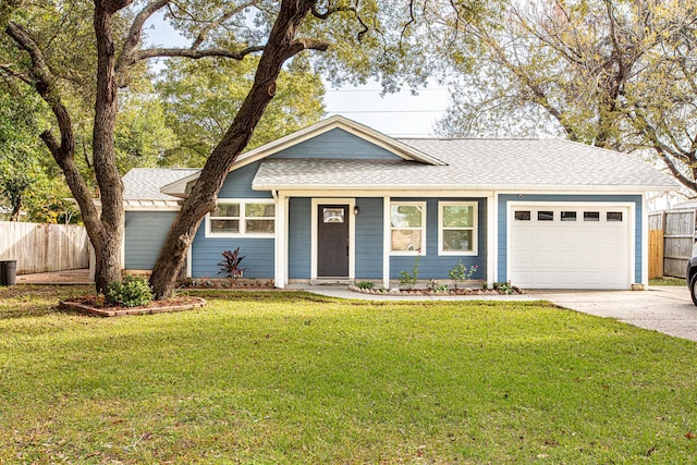 ranch-style house with a garage and a front yard